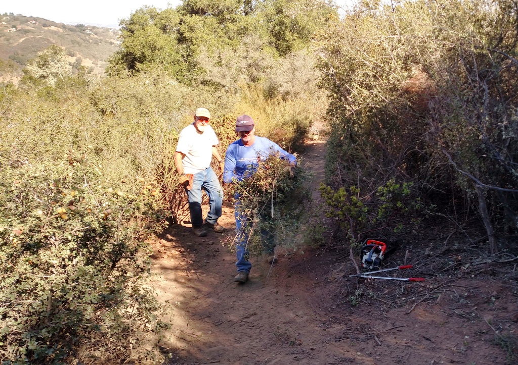 Cory and Joe brushing the trail.